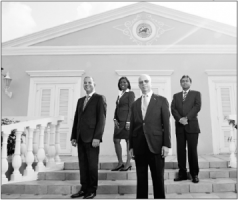 Vlnr. Stephen Capella, Rochelle Monte, Eric Garcia en Richard Rajack. Deze foto stond in de jaarrekening van de bank van 2012. FOTO GIROBANK