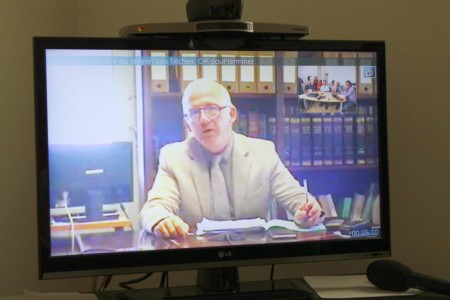 Prosecutor Samuel Finielz talks to journalists via a Skype video link from Guadeloupe on the Wendy Montulet murder case