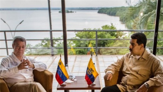 Santos, left, and Maduro plan to open five pedestrian crossings [Miguel Gutierez/EPA]