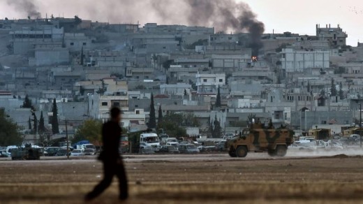 Rond en in Kobani woedt een hevige strijd tussen IS en de Koerden. | AFP .